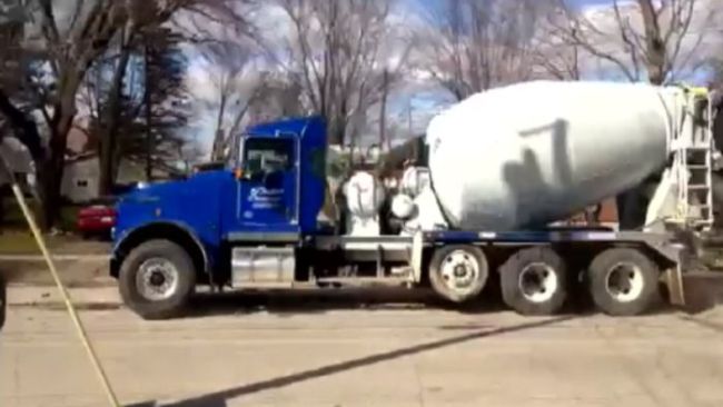 A cement truck crashes into a bridge!