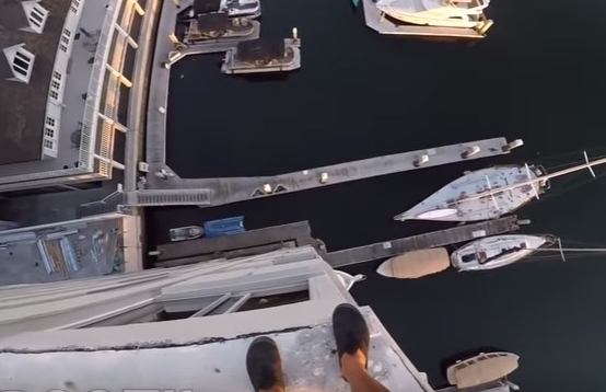 WATCH: Guy Jumps Into Marina… From 8 Stories Up